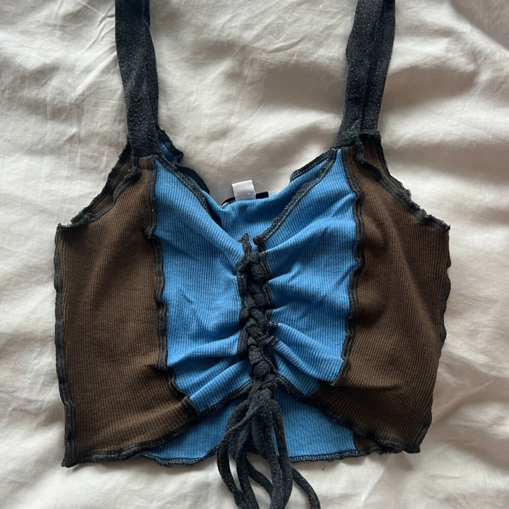 Subdued lace up crop top. Perfect condition no flaws.